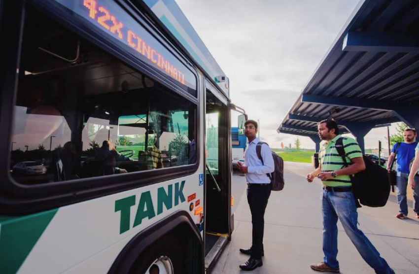 People board a public transportation bus